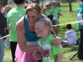 Girls on the Run woman and girl hug received May 2014