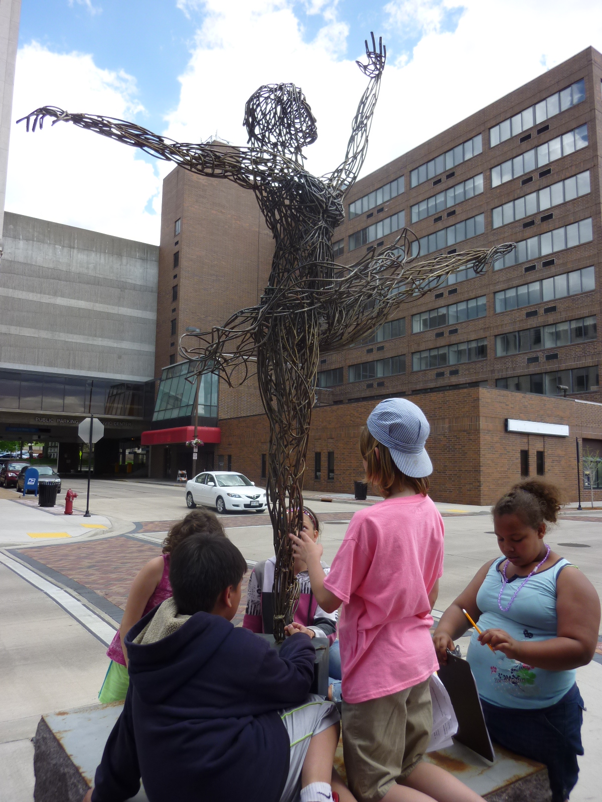 Children with dancer sculpture