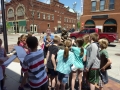 Clump of kids around sculpture